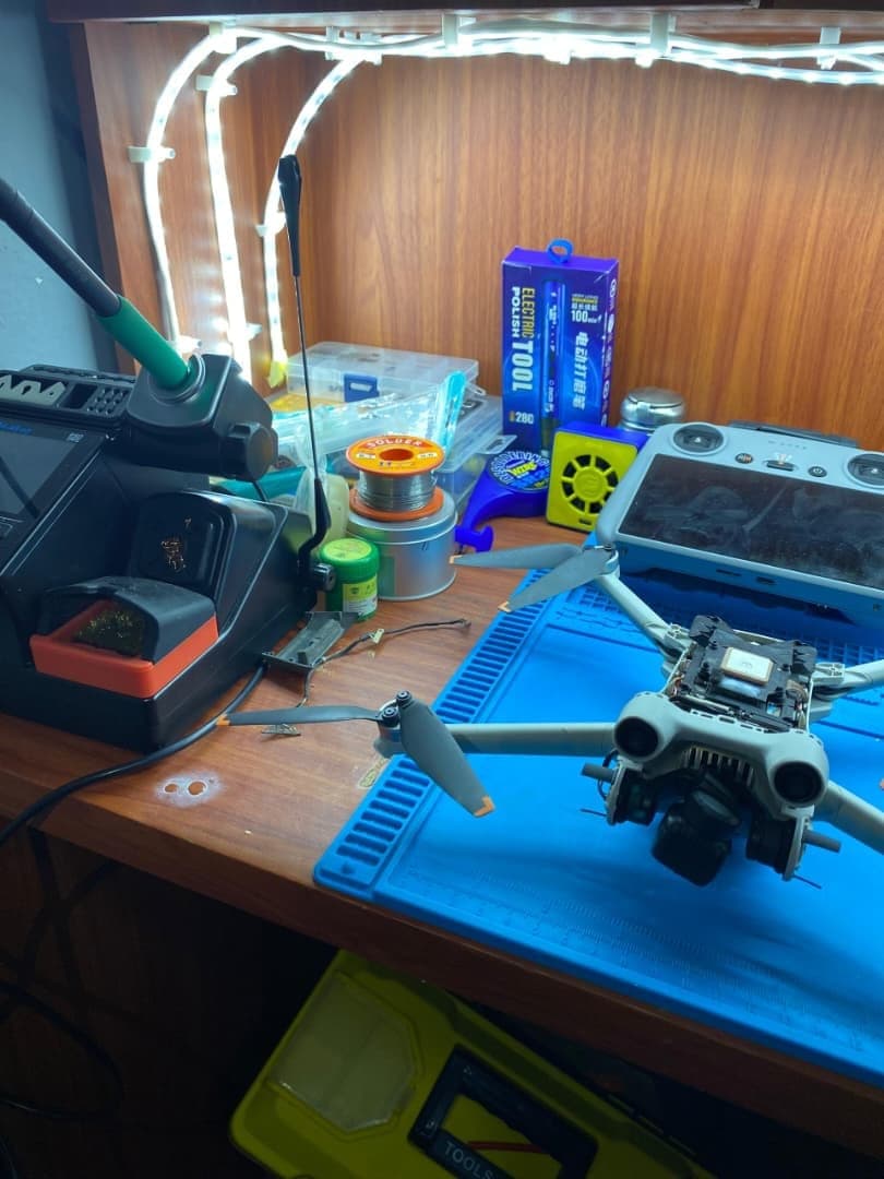 The GearUp repair bench with a soldering station, remote controller and drone